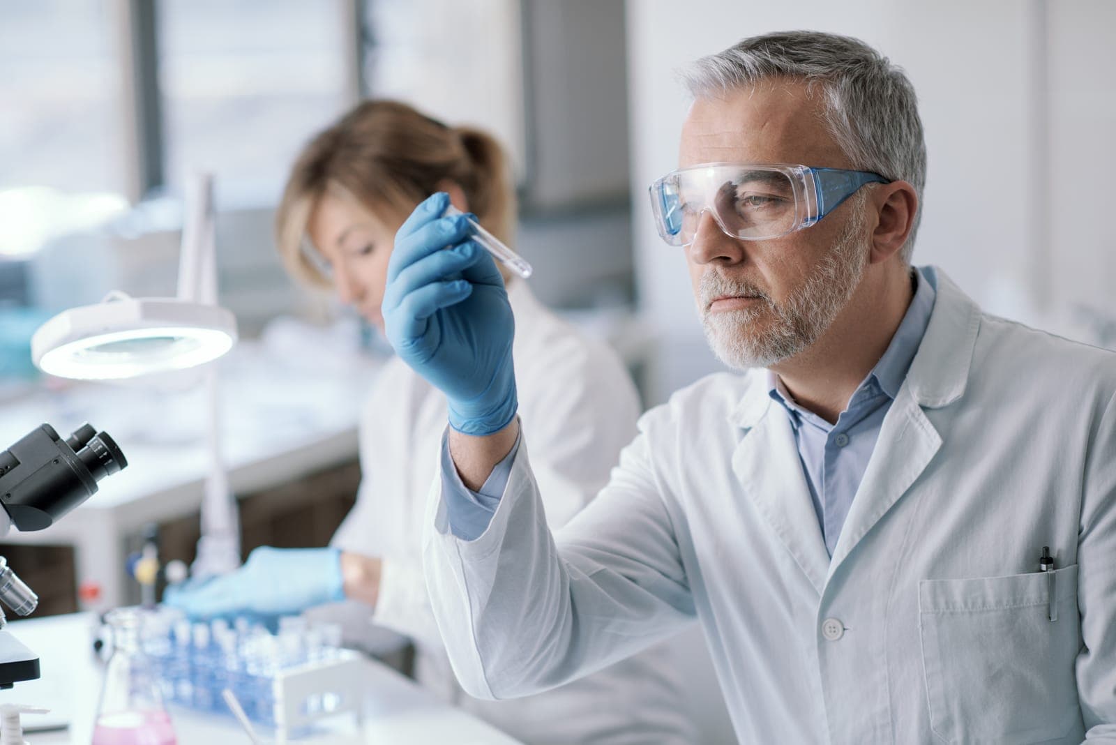 Scientist inspecting a peptide sample for purity verification